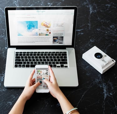 Professional person using a laptop with digital email marketing icons and notification alerts.