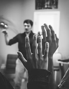 hands raised in a classroom