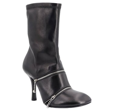 a woman's black burberry leather ankle - high heeled boots