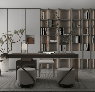 Modern home office with a minimalist wooden desk, integrated bookshelves, and sleek grey chairs.