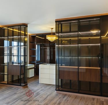 A completed modern walk-in closet featuring smoked glass cabinetry, integrated LED shelving, and a w