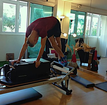 Client performing reformer leg exercise at The Pilates Room Bangsar