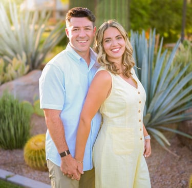 Couple smiling together during a golden hour portrait session in Arizona.