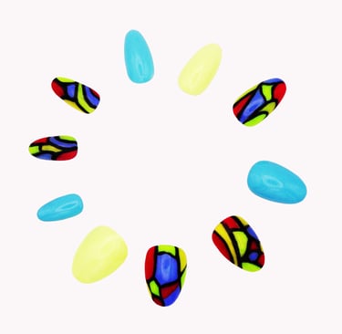 Handcrafted abstract press-on nails with azure blue, creamy yellow, red, green, and black on white by Sharp Talons