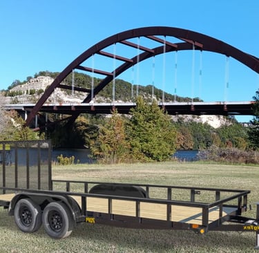 Utility trailer parked in front of Austin's Pennybacker Bridgeiler rental resource in Austin. 