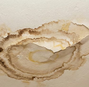 a ceiling fan with a hole in the ceiling