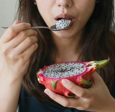 Happy customer enjoying a fresh pitahaya outdoor in a sunny garden setting