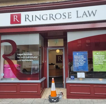 Front of Ringrose Law firm, with large branded windows and freshly red-painted detailing.