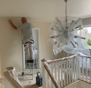 Our staff decorating an interior room in a residential home.