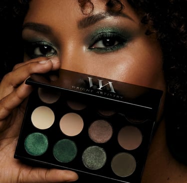Model wearing dark green shimmer eyeshadow holding a Wright Artistry neutral and green palette.