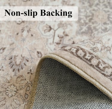 Close-up of a vintage floral area rug with a non-slip backing corner folded over.