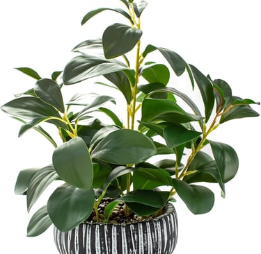 Artificial rubber plant with lush green leaves in a black and white striped ceramic pot.