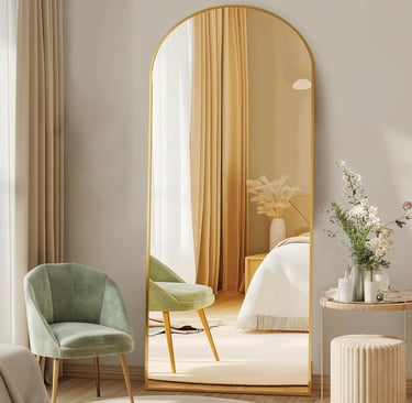 DUMOS arched floor mirror with gold frame styled in a modern bedroom interior