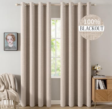 Elegant beige thermal insulated 100% blackout curtains for a bedroom window.