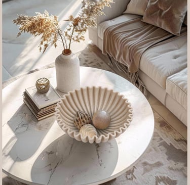 Scalloped decorative bowl styled on a modern coffee table in a cozy neutral living room