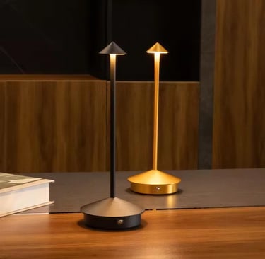 Rechargeable table lamp in a small cozy bedroom reading nook