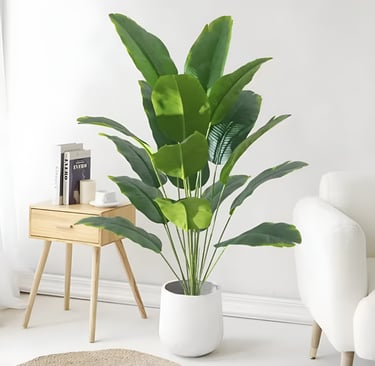 Indoor potted plant placed in a cozy bedroom reading nook for small space home decor inspiration.