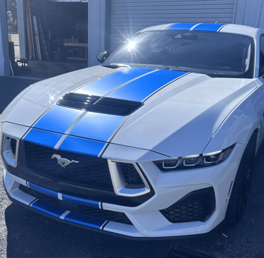 Satin black vinyl wrap finish on vehicle