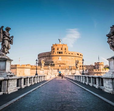Castel Sant'Angelo and the Ponte Sant'Angelo bridge with angel statues in Rome, Italy.