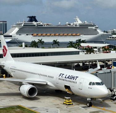 The modern terminal at New Orleans cruise port with a cruise ship preparing to set sail.
