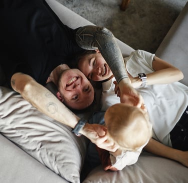 family cuddling at home in Geneva