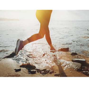 a person is running on the beach for optimizing health