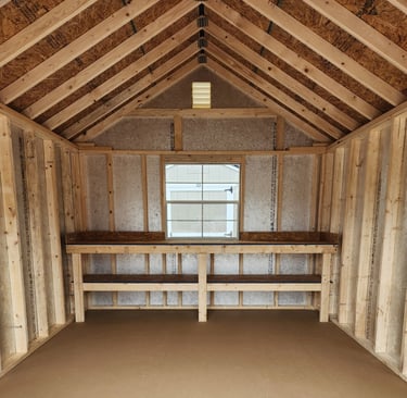Inside of shed showing workbench and window