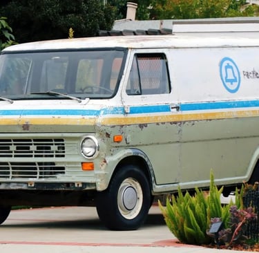 a classic van with a blue and white stripes
