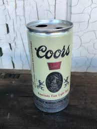 a can of coors beer on a table