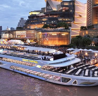 Bangkok dinner cruise experience along the river with illuminated city skyline at night