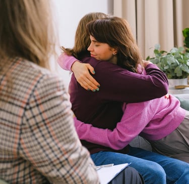 Two people hugging after therapy breakthrough