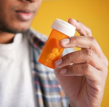 Male hold a prescription bottle