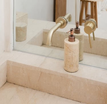 Basin built into a plastered surround.