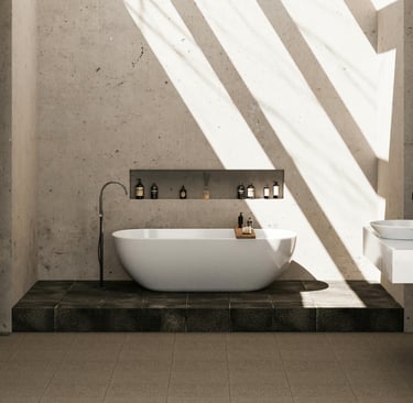Natural stone floor in a Mediterranean bathroom with raking light.