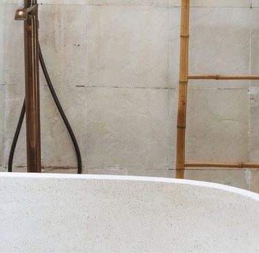 Bath positioned against the wall in a French Mediterranean bathroom.