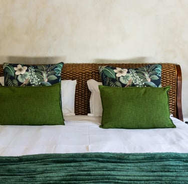 Bed centered against plaster wall