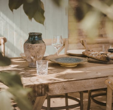 A French Medite.rranean dining room in seasonal warm light