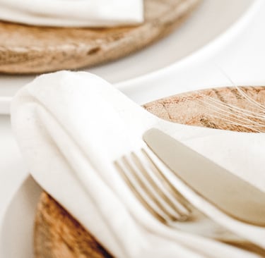 Linen on a wood dining table, French Mediterranean.