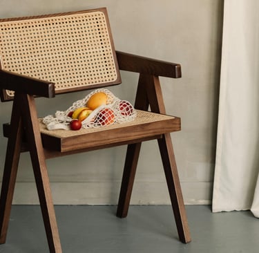 Low grounded dining chair in a French Mediterranean room.