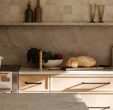 Stone counter meeting lime plaster in a French Mediterranean kitchen!