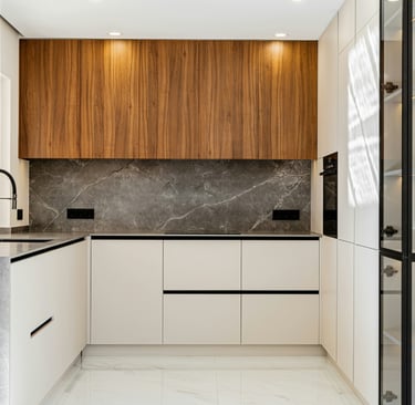 Closed cabinet fronts as continuous wall in a French Mediterranean kitchen!