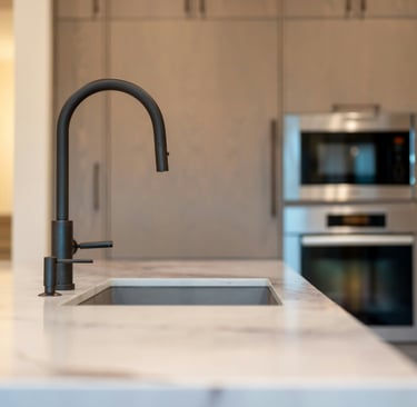 Honed stone kitchen counter with light raking across in a French Mediterranean kitchen!