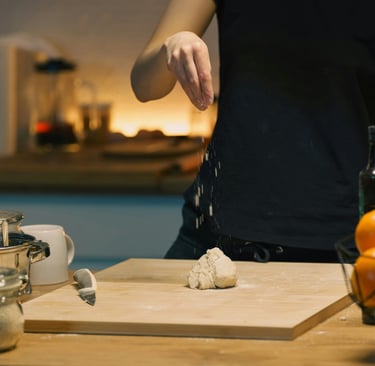 Hands working at a correctly proportioned French Mediterranean kitchen counter.