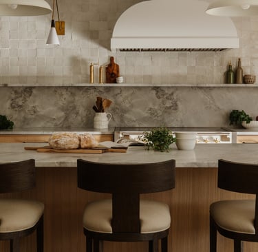 Kitchen island aligned with the main counter in a French Mediterranean kitchen.