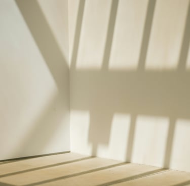 Empty corner with afternoon light in a French Mediterranean room.