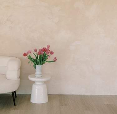 Low seating and vertical space in a French Mediterranean living room.
