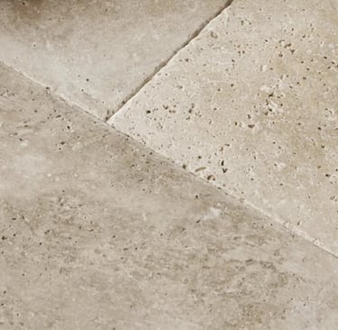 Honed limestone in a French Mediterranean living room.