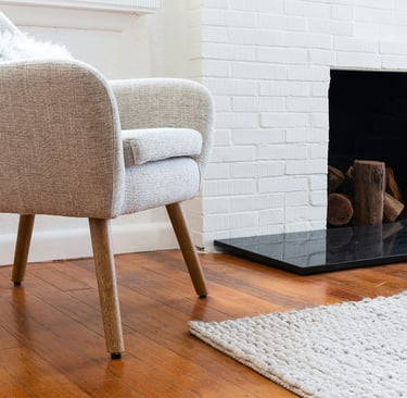 Seating arrangement with negative space in a French Mediterranean living room.