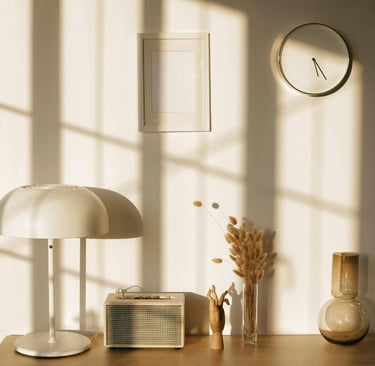 Midday light with short shadows across the pale surfaces of a Mediterranean room