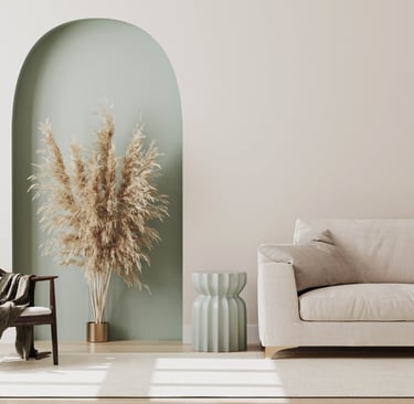 A new build living room with wooden shutters, limewash walls and a linen sofa.